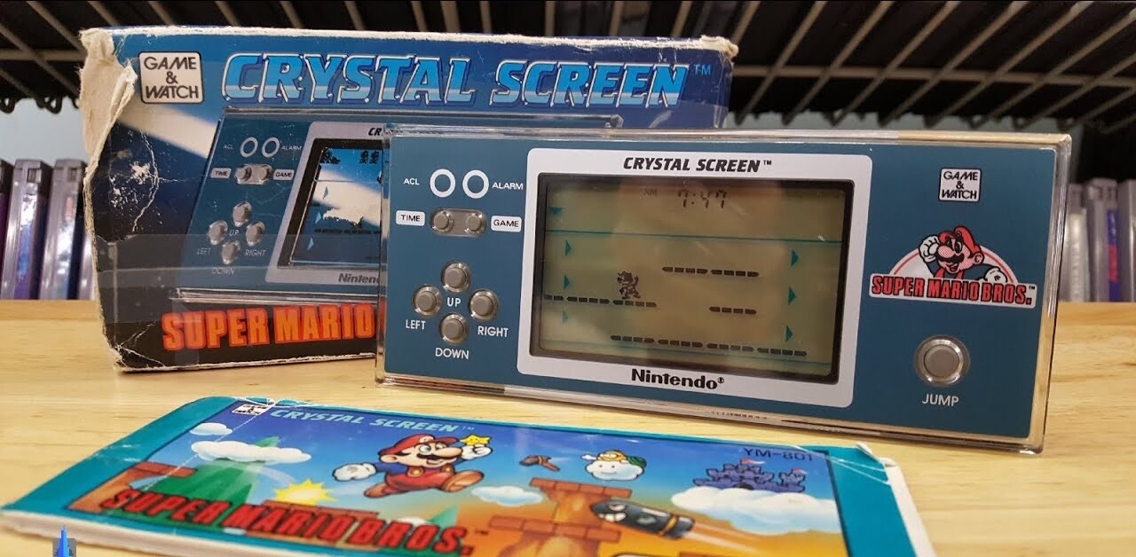 Caixa, manual e o Game & Watch Crystal Screen: Super Mario Bros