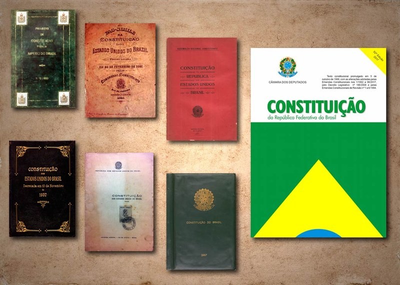 A Constituição Cidadã de 1988, ao lado de exemplares, em tamanho menor, de 6 antecessoras