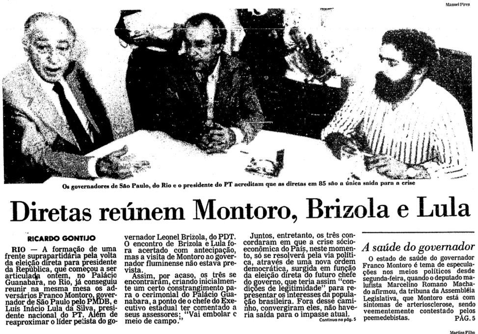 Recorte da Folha com foto do encontro e o título: “Diretas reúnem Montoro, Brizola e Lula“